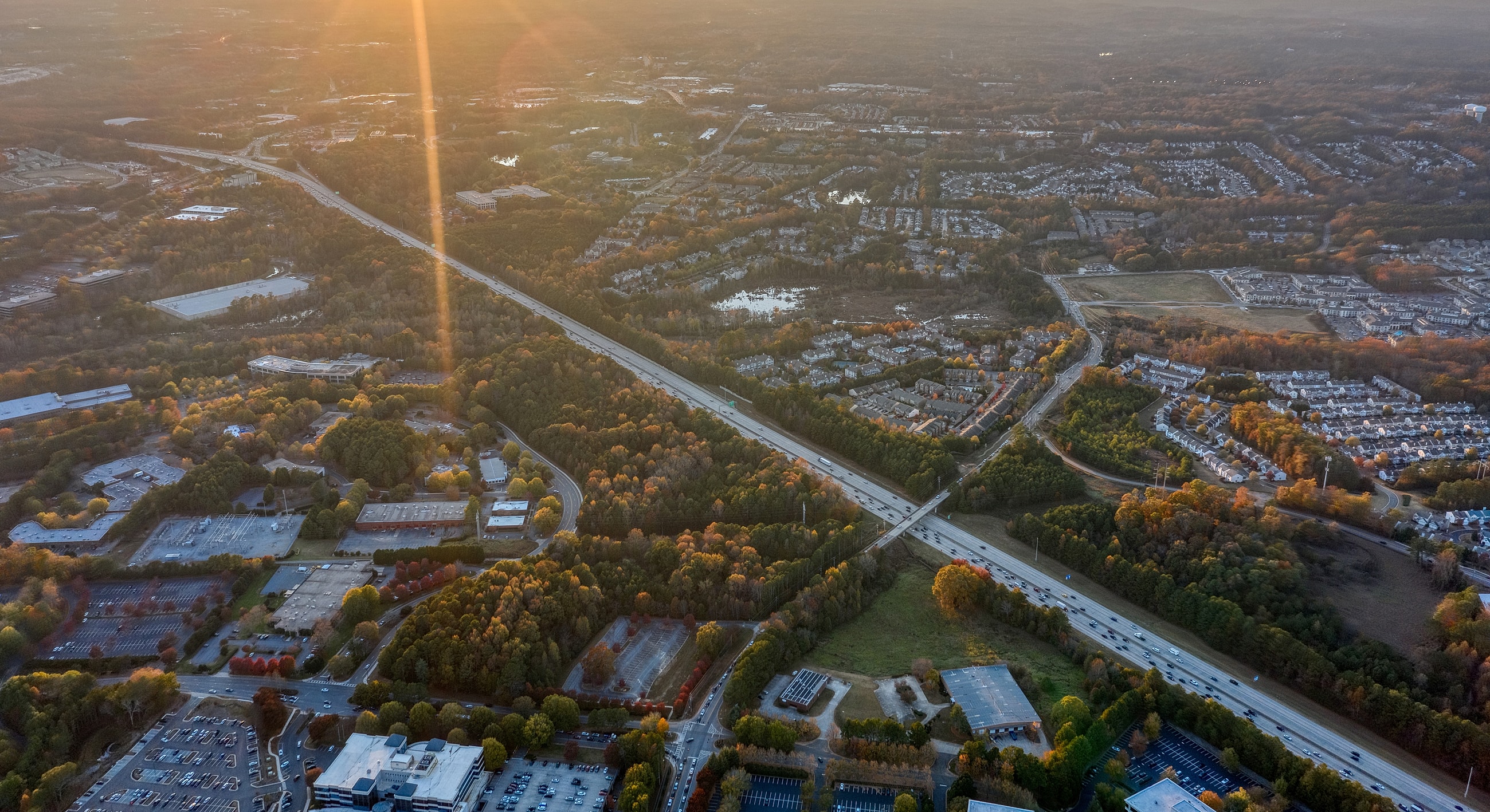 Aerial view of highway and residential areas.
